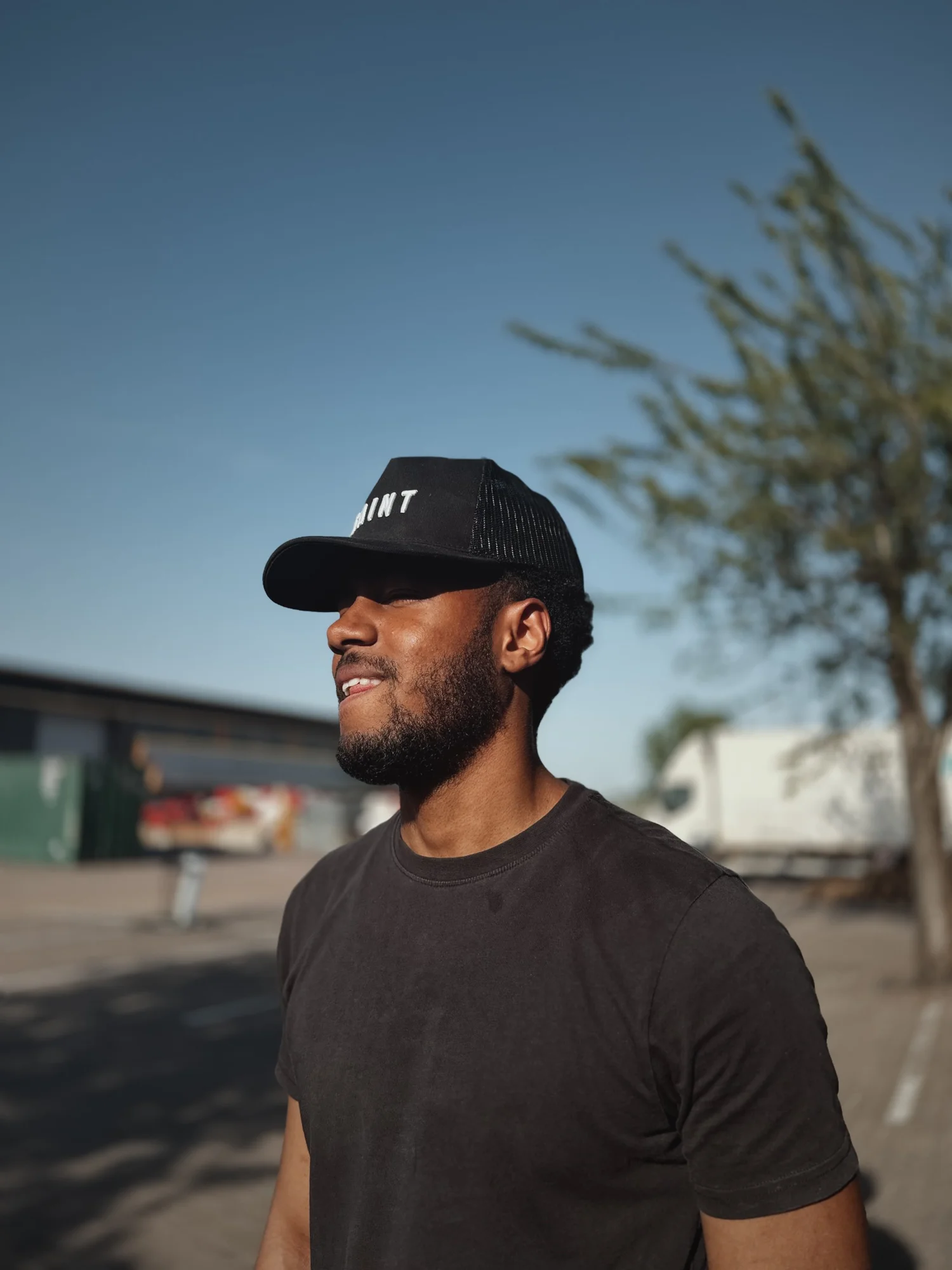 Keston in the black Saint trucker hat