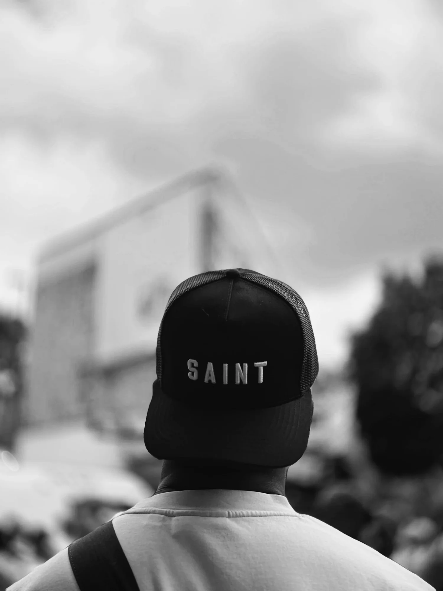 Back view of a SAINT cap in a crowd